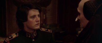 Movie still from “Dune” (1984), directed by David Lynch – A man in a military uniform looking to his left; Close Up shot, Over the shoulder angle
