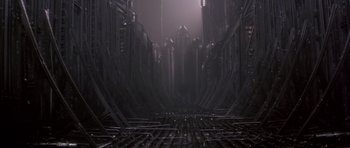 Movie still from “Dune” (1984), directed by David Lynch – An empty train track in the middle of a train station; Extreme Wide shot, High angle