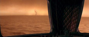 Movie still from “Dune” (1984), directed by David Lynch – A view from a boat looking out over the ocean at sunset or sunrise; Extreme Wide shot, High angle