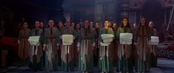 Movie still from “Dune” (1984), directed by David Lynch – A group of people standing next to each other; Wide shot, High angle