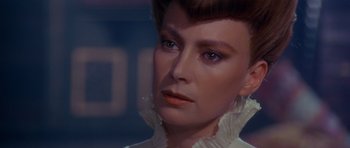 Movie still from “Dune” (1984), directed by David Lynch – A person wearing a white shirt; Close Up shot, Over the shoulder angle