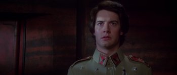 Movie still from “Dune” (1984), directed by David Lynch – A man in a uniform looking to his left; Close Up shot, Low angle