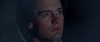 Movie still from “Dune” (1984), directed by David Lynch – A person's face in the dark; Close Up shot, Low angle