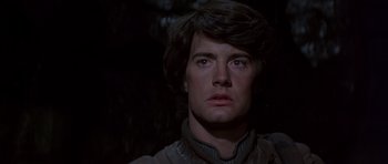 Movie still from “Dune” (1984), directed by David Lynch – A person wearing a helmet; Close Up shot, Over the shoulder angle