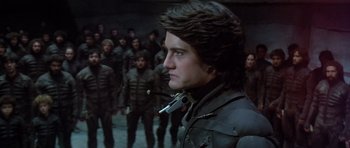 Movie still from “Dune” (1984), directed by David Lynch – A person with a gun in his mouth; Close Up shot, Over the shoulder angle