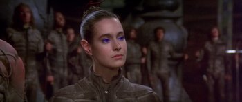 Movie still from “Dune” (1984), directed by David Lynch – A person wearing a jacket; Close Up shot, Over the shoulder angle