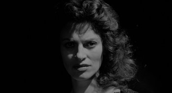 Movie still from “Eraserhead” (1977), directed by David Lynch – A black and white photo of a woman's face; Close Up shot, Low angle