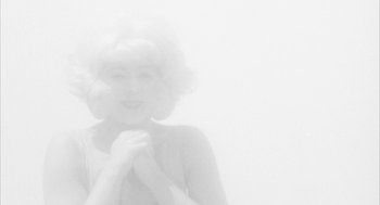 Movie still from “Eraserhead” (1977), directed by David Lynch – A black - and - white photo of a woman in a wig; Medium shot, Low angle