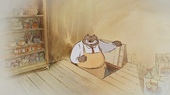 Movie still from “Ernest & Celestine” (2012), directed by Vincent Patar – A cartoon of a man in a suit sitting in a doorway; Medium shot, Low angle