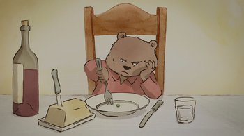Movie still from “Ernest & Celestine” (2012), directed by Vincent Patar – A bear sitting at a table with a bowl of food in front of him; Close Up shot, High angle