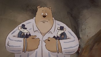 Movie still from “Ernest & Celestine” (2012), directed by Vincent Patar – A cartoon of a bear holding two mice in his arms; Close Up shot, Overhead angle