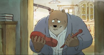 Movie still from “Ernest and Celestine: A Trip to Gibberitia” (2022), directed by Jean-Christophe Roger – An animated bear is holding a pair of shoes; Close Up shot, Overhead angle