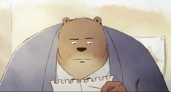 Movie still from “Ernest and Celestine: A Trip to Gibberitia” (2022), directed by Jean-Christophe Roger – An illustration of a brown bear holding a piece of paper; Extreme Close Up shot, High angle