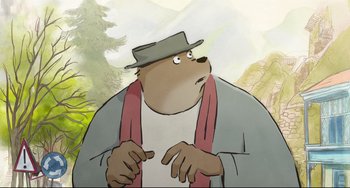 Movie still from “Ernest and Celestine: A Trip to Gibberitia” (2022), directed by Jean-Christophe Roger – A cartoon of a bear wearing a hat and a scarf; Close Up shot, High angle