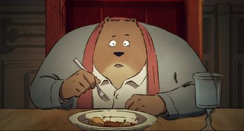 Movie still from “Ernest and Celestine: A Trip to Gibberitia” (2022), directed by Jean-Christophe Roger – An animated bear sitting in front of a plate of food; Close Up shot, High angle