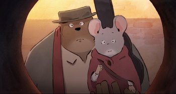 Movie still from “Ernest and Celestine: A Trip to Gibberitia” (2022), directed by Jean-Christophe Roger – An animated bear and a mouse are standing next to each other; Close Up shot, High angle