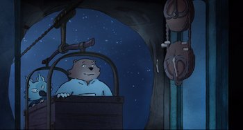 Movie still from “Ernest and Celestine: A Trip to Gibberitia” (2022), directed by Jean-Christophe Roger – An animated bear is sitting in a chair; Medium shot, High angle