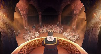 Movie still from “Ernest and Celestine: A Trip to Gibberitia” (2022), directed by Jean-Christophe Roger – An audience of people sitting in a circle in front of a stage; Extreme Wide shot, High angle