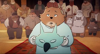 Movie still from “Ernest and Celestine: A Trip to Gibberitia” (2022), directed by Jean-Christophe Roger – A cartoon of a bear holding an animal in front of a group of people; Close Up shot, High angle