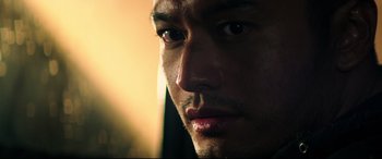 Movie still from “Escape Plan 2: Hades” (2018), directed by Steven C. Miller – A man's face in the sunlight; Close Up shot, Low angle