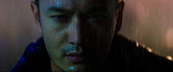 Movie still from “Escape Plan 2: Hades” (2018), directed by Steven C. Miller – A man's face in the rain; Extreme Close Up shot, Low angle