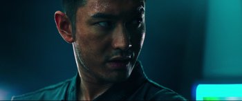 Movie still from “Escape Plan 2: Hades” (2018), directed by Steven C. Miller – A man's face in a dark room; Close Up shot, Low angle