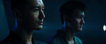 Movie still from “Escape Plan 2: Hades” (2018), directed by Steven C. Miller – A man with a beard is looking into the distance; Close Up shot, Low angle