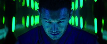 Movie still from “Escape Plan 2: Hades” (2018), directed by Steven C. Miller – A person in a room with neon lights; Close Up shot, Low angle