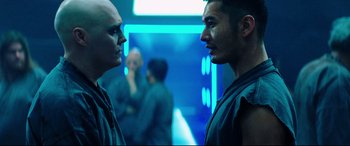 Movie still from “Escape Plan 2: Hades” (2018), directed by Steven C. Miller – Two men are facing each other in a room; Close Up shot, Over the shoulder angle