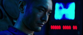 Movie still from “Escape Plan 2: Hades” (2018), directed by Steven C. Miller – A man's face in the dark; Close Up shot, Low angle