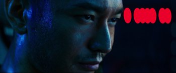 Movie still from “Escape Plan 2: Hades” (2018), directed by Steven C. Miller – A man's face in the dark; Extreme Close Up shot, Low angle