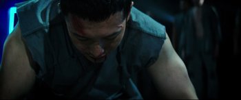 Movie still from “Escape Plan 2: Hades” (2018), directed by Steven C. Miller – A young man with blood all over his face; Close Up shot, High angle