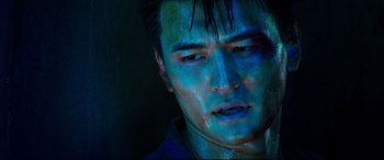 Movie still from “Escape Plan 2: Hades” (2018), directed by Steven C. Miller – A person with blue paint on his face; Close Up shot, Low angle