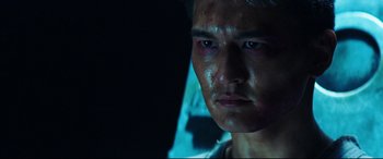 Movie still from “Escape Plan 2: Hades” (2018), directed by Steven C. Miller – A man's face in the dark; Close Up shot, Low angle