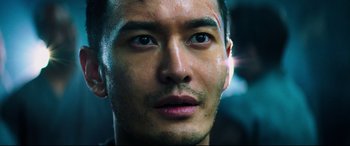 Movie still from “Escape Plan 2: Hades” (2018), directed by Steven C. Miller – A man's face in the sunlight; Close Up shot, Low angle