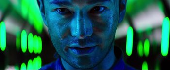 Movie still from “Escape Plan 2: Hades” (2018), directed by Steven C. Miller – A person's face with blue paint on his face; Extreme Close Up shot, Low angle
