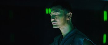 Movie still from “Escape Plan 2: Hades” (2018), directed by Steven C. Miller – A man with his eyes closed in the dark; Close Up shot, Low angle