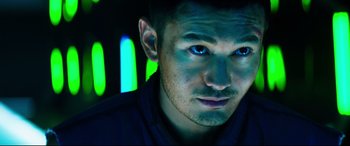 Movie still from “Escape Plan 2: Hades” (2018), directed by Steven C. Miller – A person wearing a black shirt; Close Up shot, Low angle