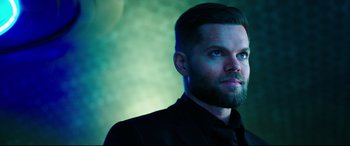 Movie still from “Escape Plan 2: Hades” (2018), directed by Steven C. Miller – A man with a beard is looking into the distance; Close Up shot, Low angle