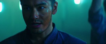 Movie still from “Escape Plan 2: Hades” (2018), directed by Steven C. Miller – A person with makeup on his face; Close Up shot, Low angle