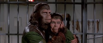 Movie still from “Escape from the Planet of the Apes” (1971), directed by Don Taylor – A man and a woman dressed like apes; Close Up shot, High angle