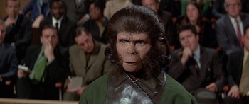 Movie still from “Escape from the Planet of the Apes” (1971), directed by Don Taylor – An image of a man with a monkey face; Close Up shot, Over the shoulder angle