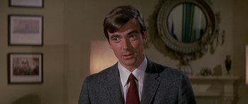 Movie still from “Escape from the Planet of the Apes” (1971), directed by Don Taylor – A person wearing a suit and tie; Close Up shot, Over the shoulder angle