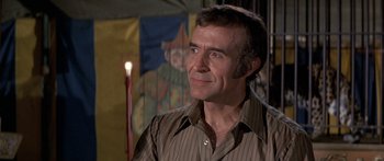 Movie still from “Escape from the Planet of the Apes” (1971), directed by Don Taylor – A person wearing a brown shirt; Close Up shot, Low angle