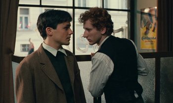 Movie still from “Europa Europa” (1990), directed by Agnieszka Holland – Two young men are talking to one another; Close Up shot, Over the shoulder angle