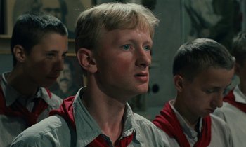 Movie still from “Europa Europa” (1990), directed by Agnieszka Holland – A group of young men standing next to each other in a room; Close Up shot, Low angle