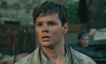 Movie still from “Europa Europa” (1990), directed by Agnieszka Holland – A young man with brown eyes looking at the camera; Close Up shot, High angle
