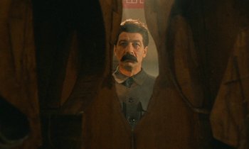 Movie still from “Europa Europa” (1990), directed by Agnieszka Holland – A man with a mustache looking into a mirror; Medium shot, Low angle