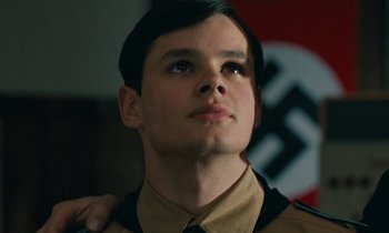 Movie still from “Europa Europa” (1990), directed by Agnieszka Holland – A young man in a military uniform looking up; Close Up shot, Low angle