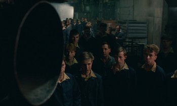 Movie still from “Europa Europa” (1990), directed by Agnieszka Holland – A group of young men standing in front of a mirror; Wide shot, High angle